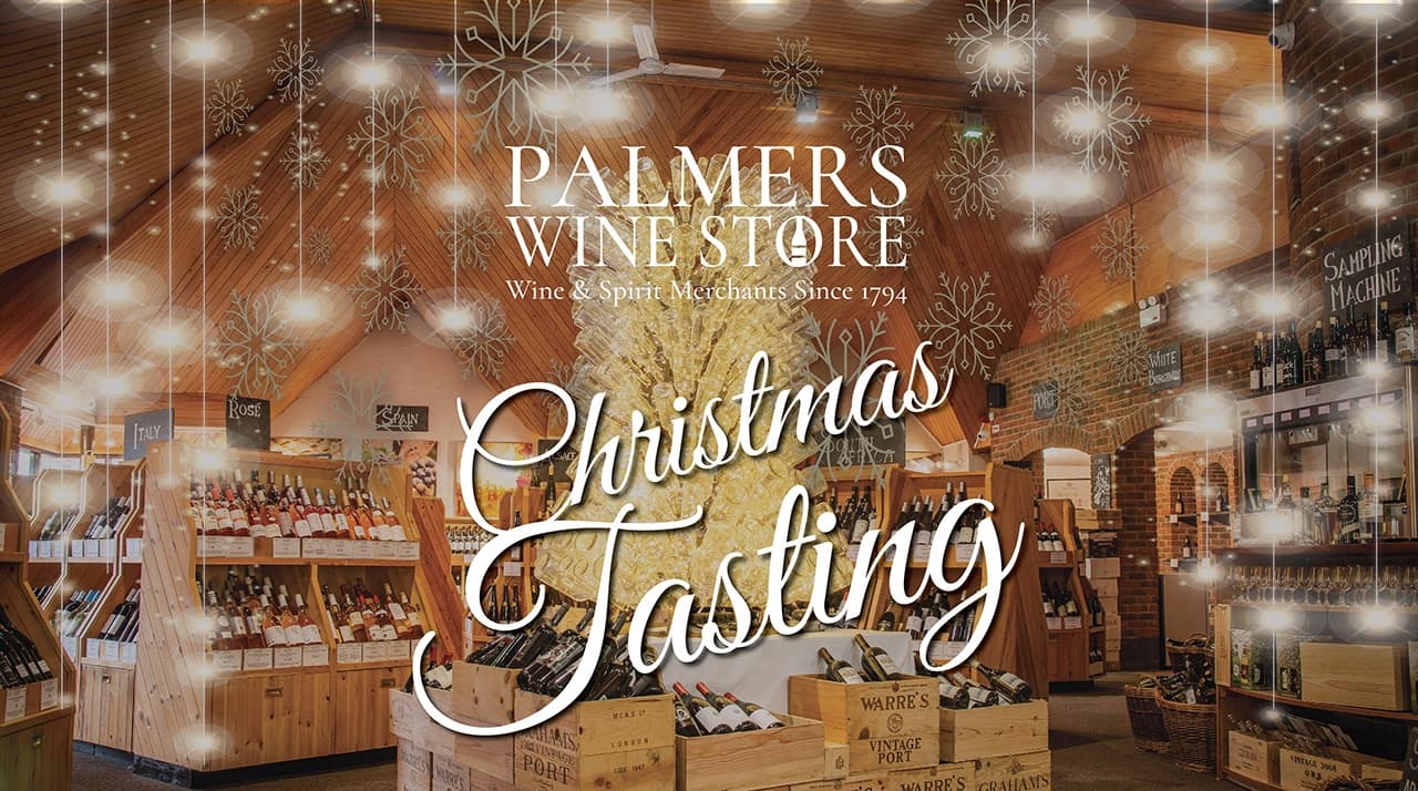 Indoor wine shop Christmas tasting with festive lights and shelves