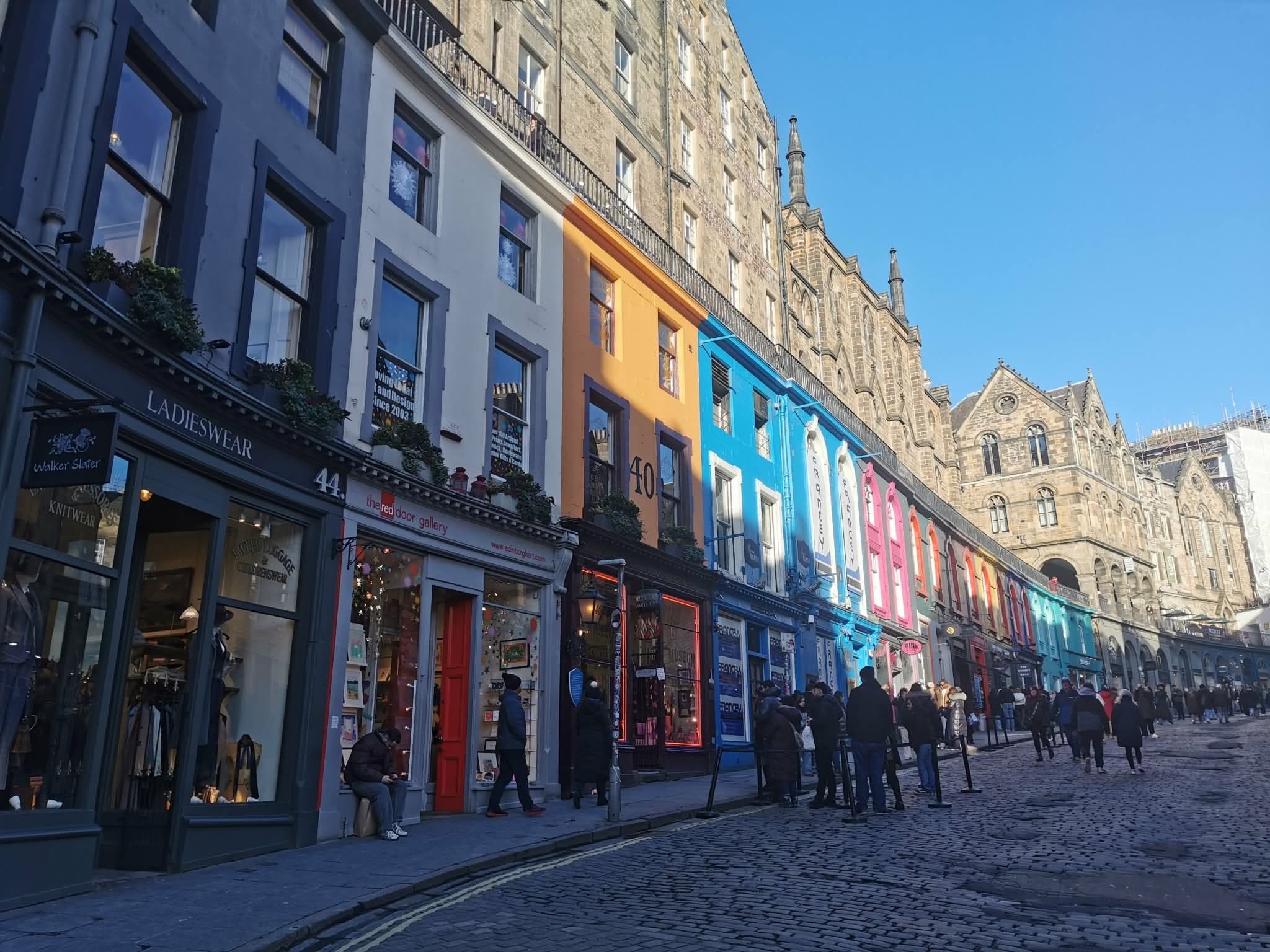 Colorful Victoria Street curve with shops in Edinburgh