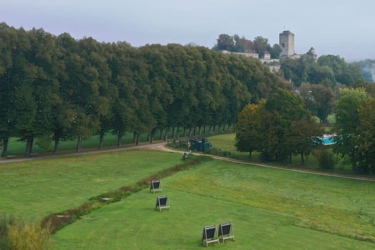 Wide parkland approach to river and distant castle ideal for paddling
