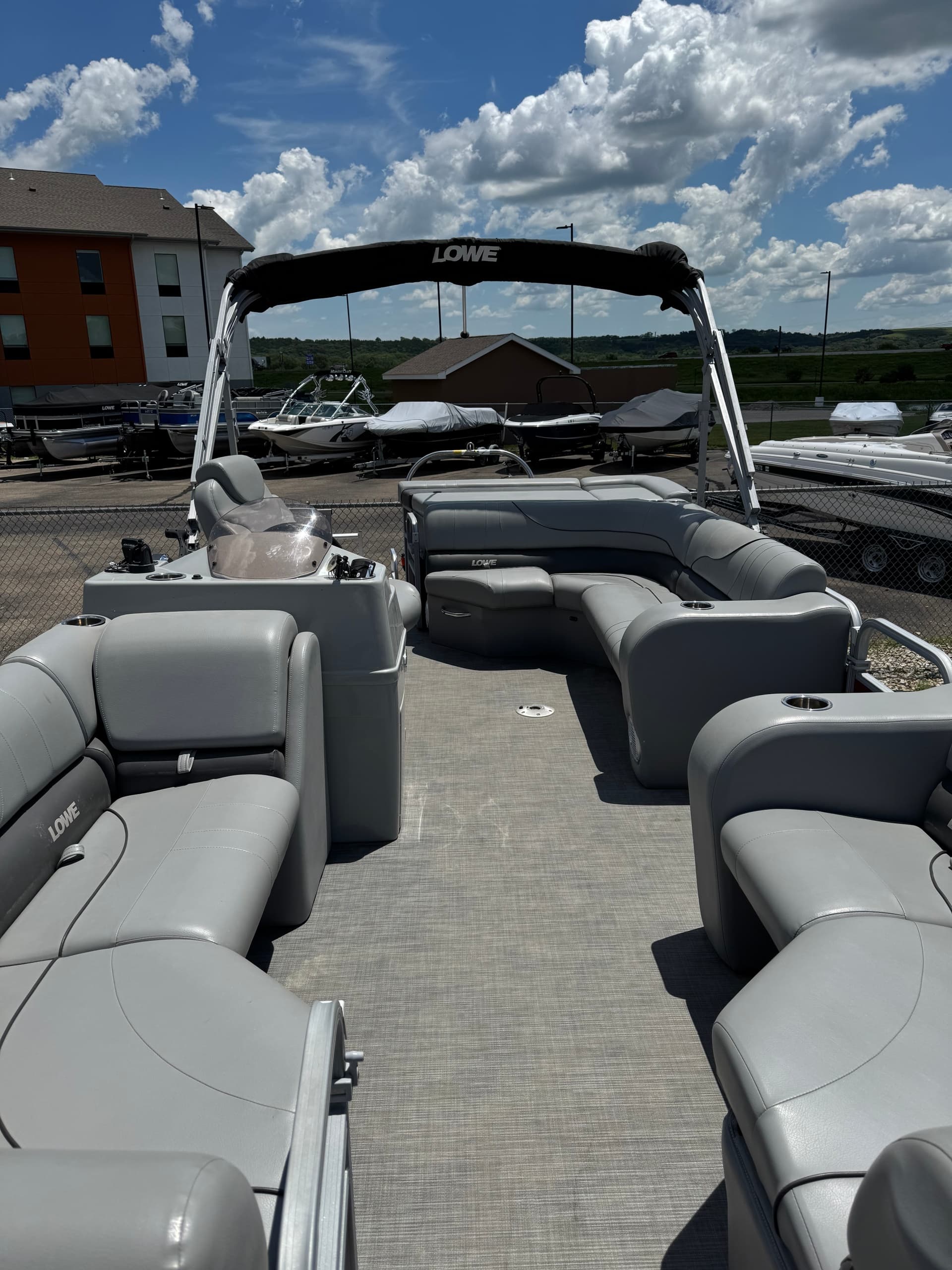 Pontoon boat deck at Milford State Park marina under blue sky