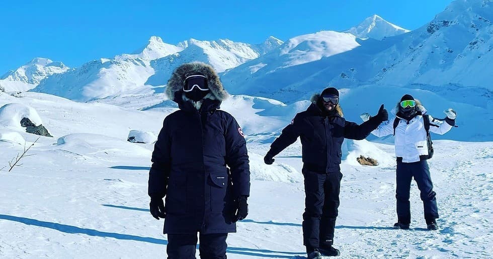 Winter mountaineering group trekking on snowy alpine slopes