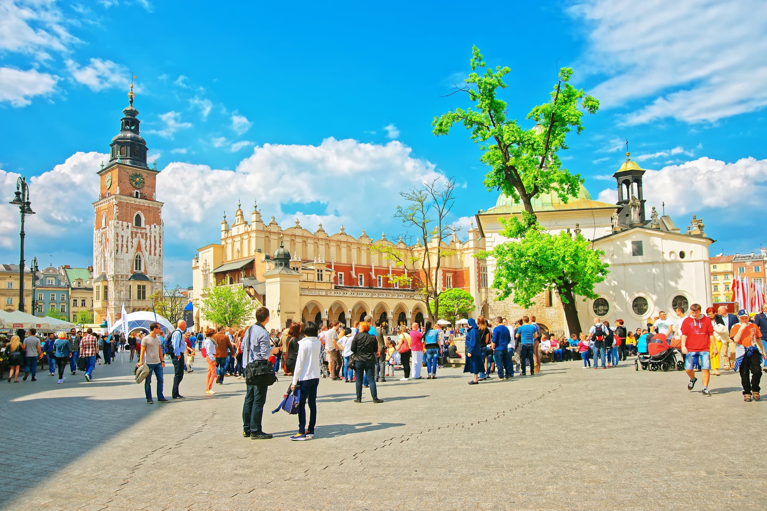 Crowds exploring Krakow Market Square outdoors sightseeing