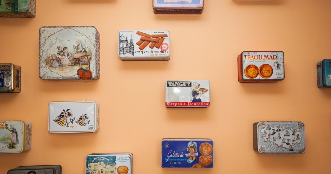 Colorful vintage tin collection on cafe wall for decor