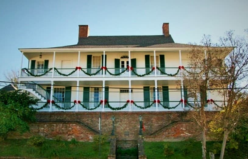 Two-story Southern mansion with wraparound porches in Natchez tour