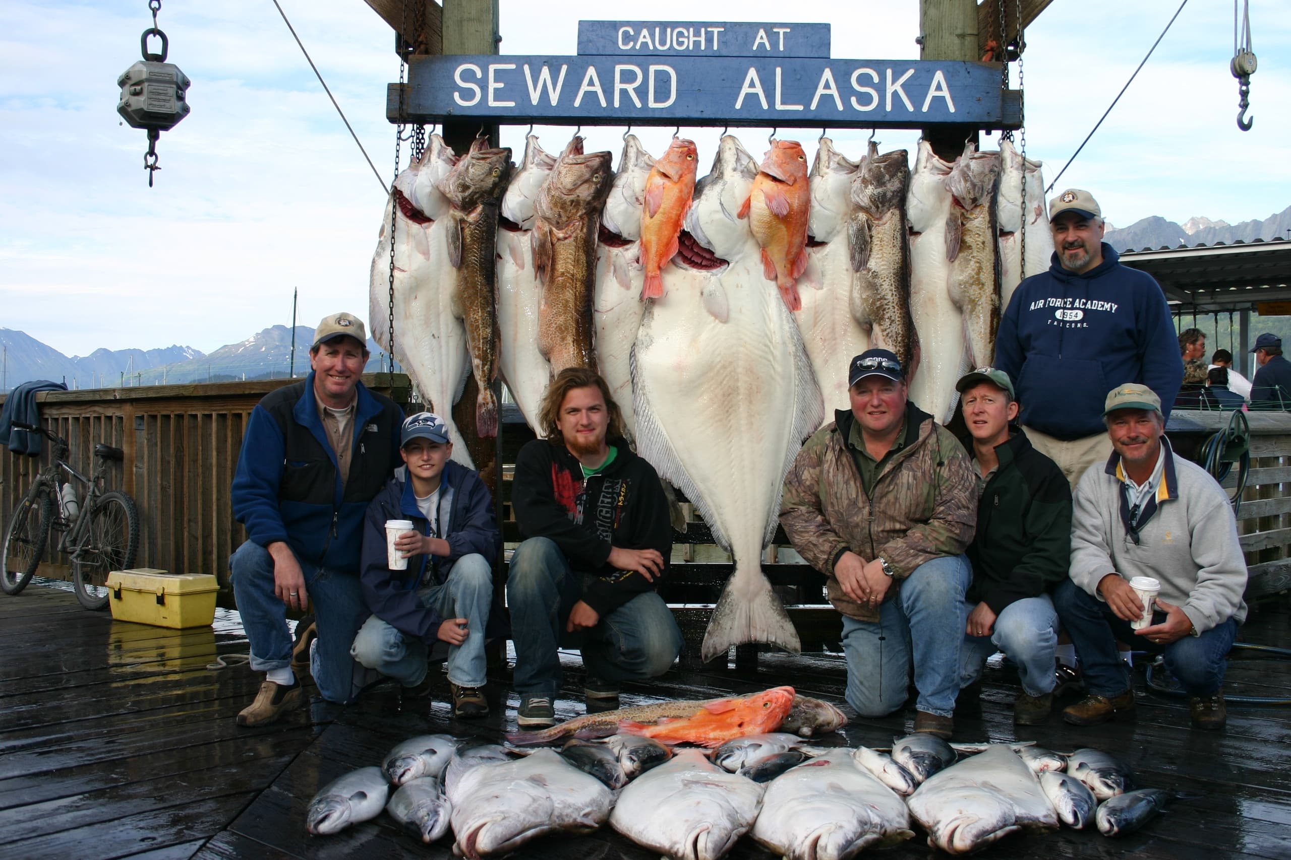 Charter fishing group with halibut and salmon in Seward Alaska