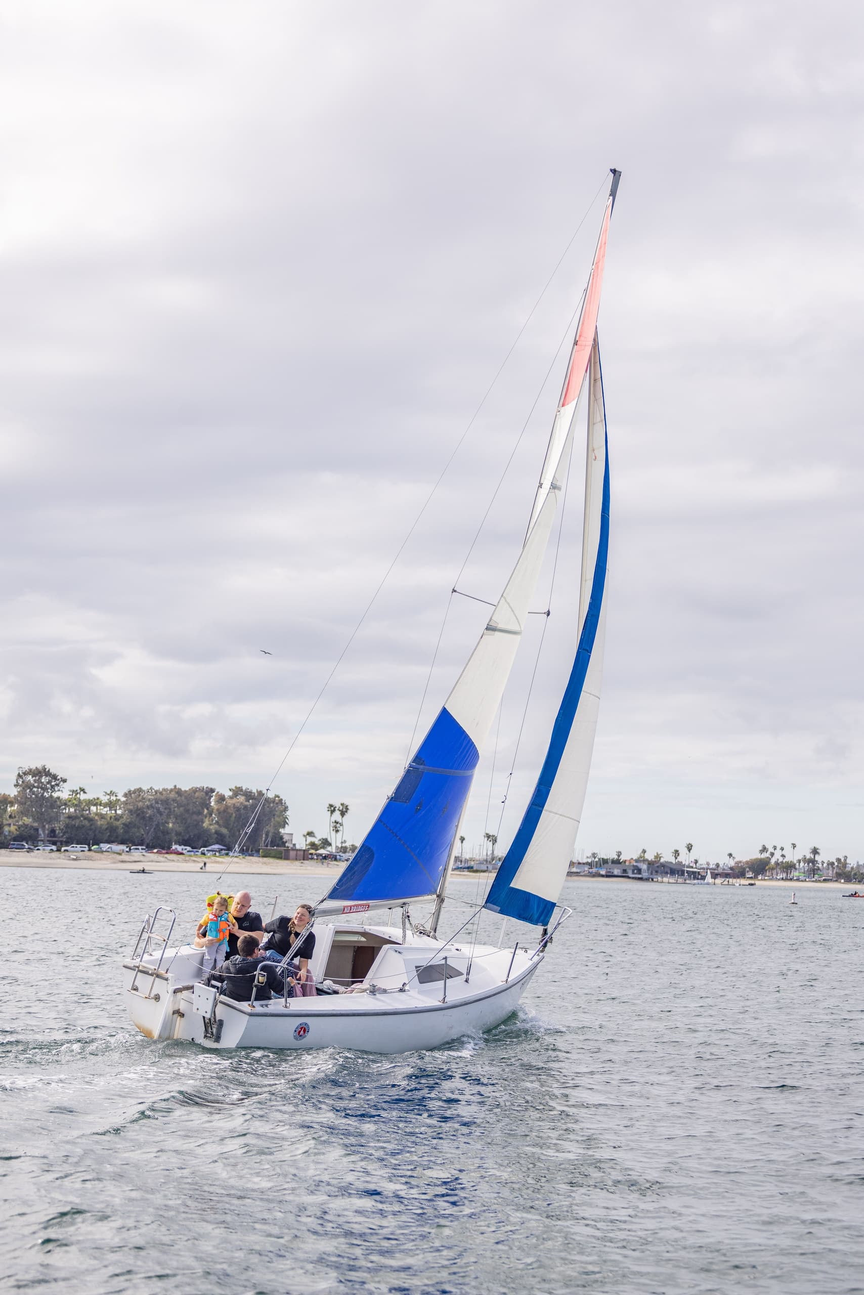 Passengers relaxing on a leisure boat in calm marina waters