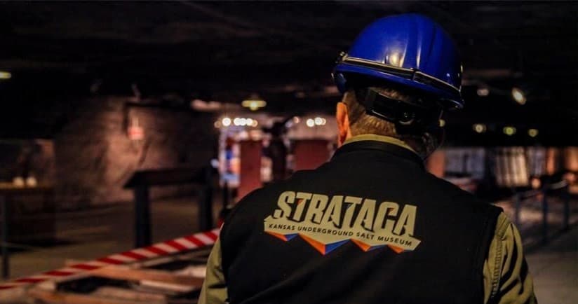 Guided underground mine tour staff wearing safety helmet