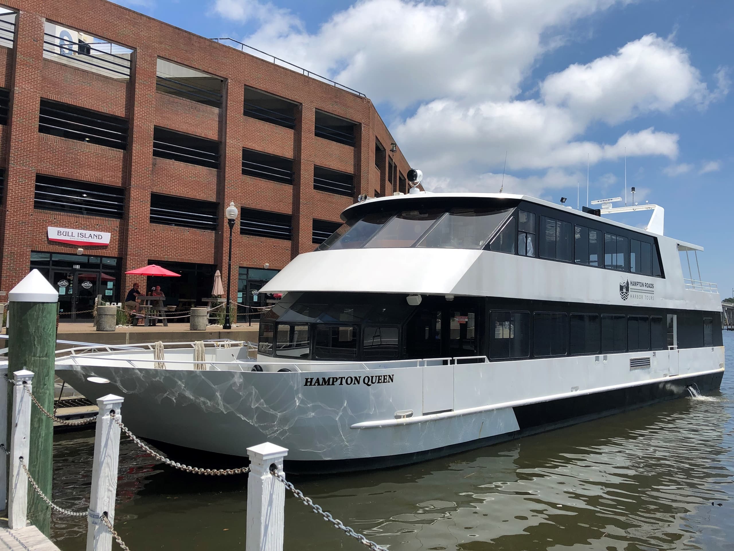 Docked tour yacht at waterfront pier near downtown marina