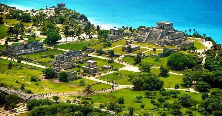 Aerial view of Tulum Mayan ruins by turquoise Caribbean coast