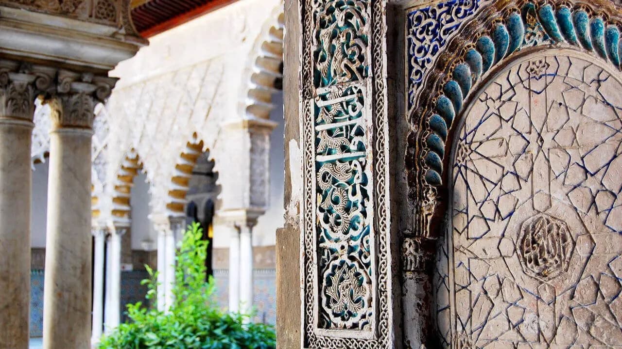Decorative Moorish palace arches and tiles at Alcázar