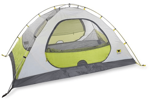 Freestanding dome tent pitched in grassy campsite with sky
