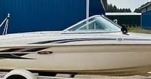 Bow of speedboat on trailer at marina lot, boat for rental