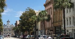 Historic downtown Charleston street with shaded walkways