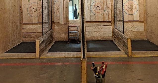 Indoor axe-throwing lanes with targets in urban entertainment venue