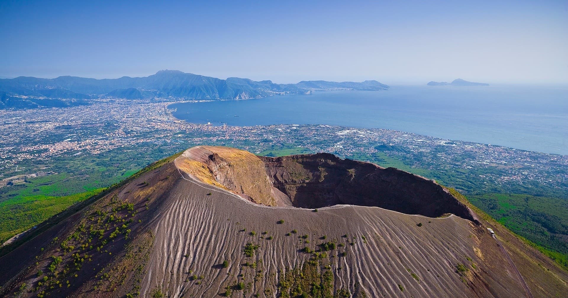 Aerial view of Mount Vesuvius crater and surrounding coastline