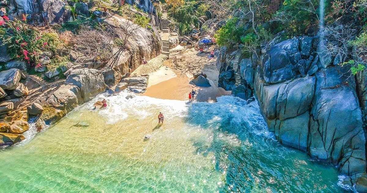 Aerial view of secluded tropical cove with turquoise water