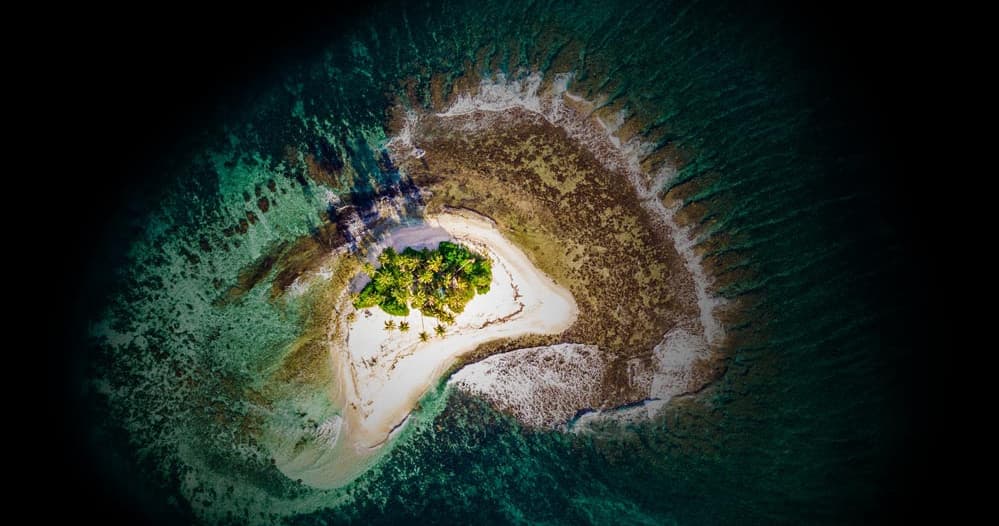 Aerial view of sandbar island for boat anchoring and snorkeling