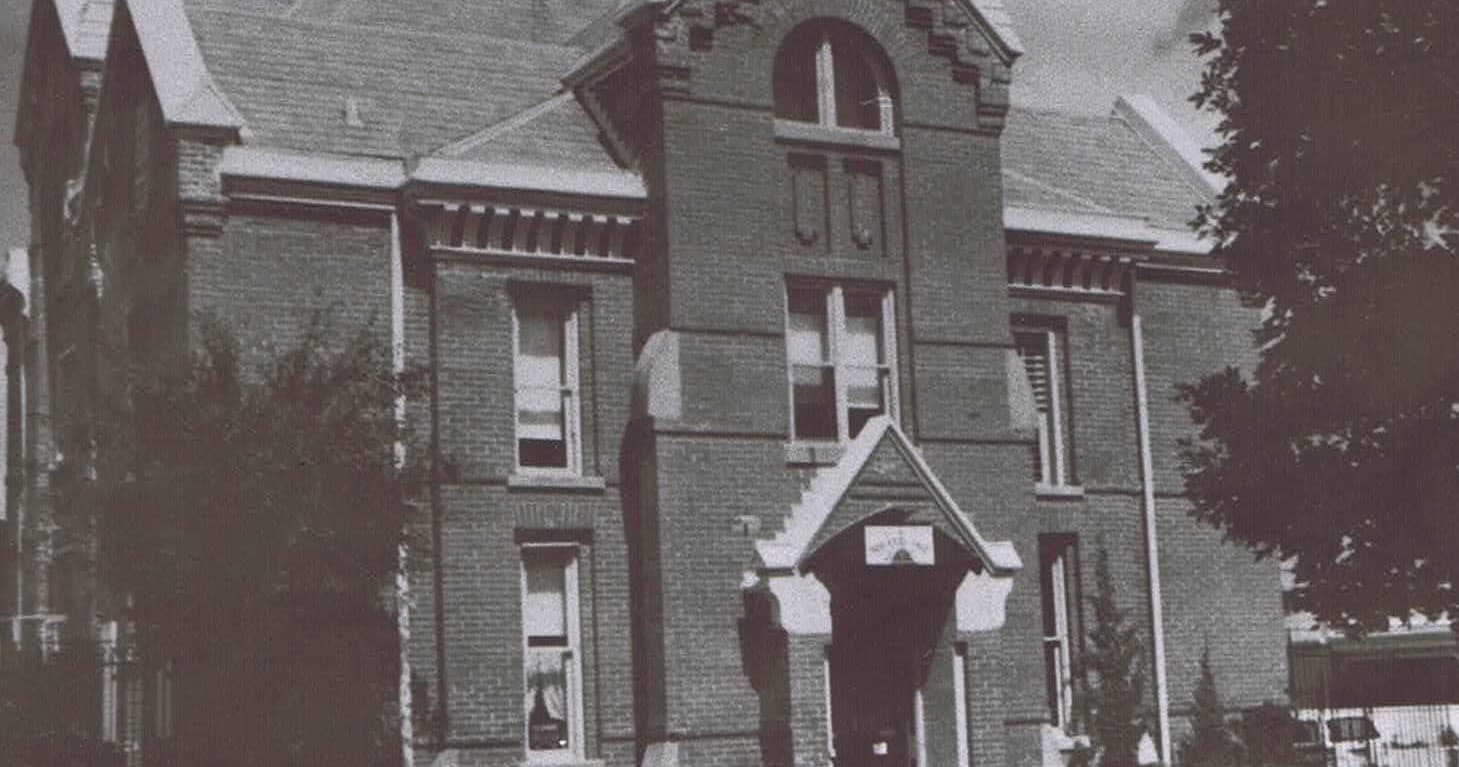Vintage brick courthouse façade and entrance, historic exterior