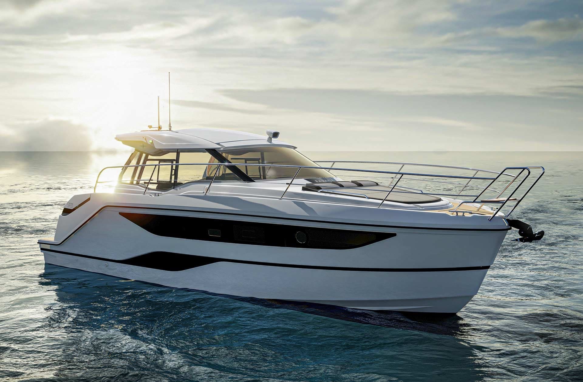 Motor yacht cruising toward sunset over open sea