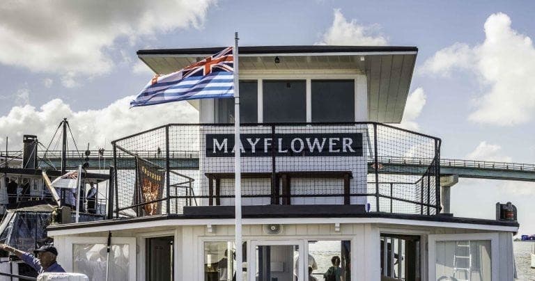 Mayflower riverboat upper deck and signage at riverside dock
