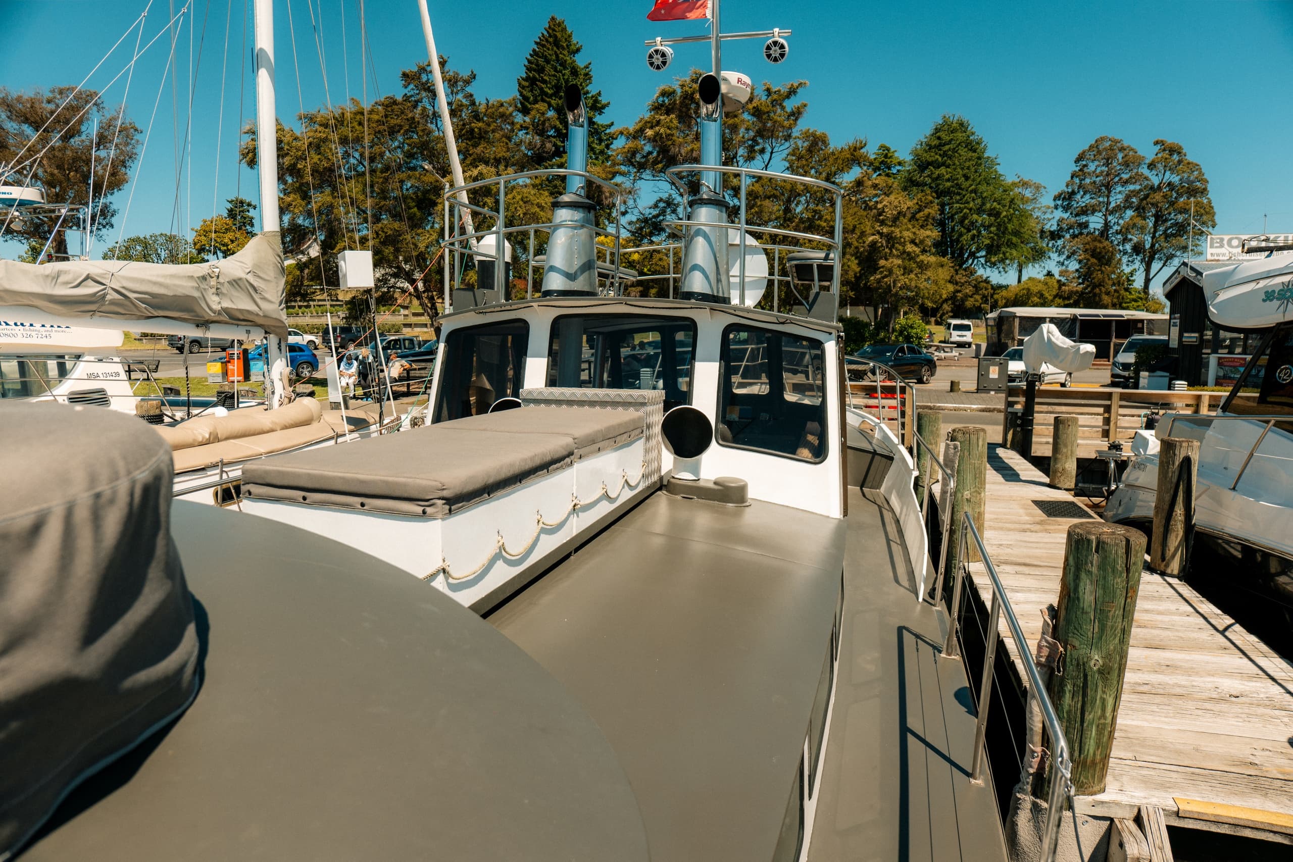 Classic Loloma Charter: Lake Taupō Cruises to Māori Rock Carvings, Fishing & Events