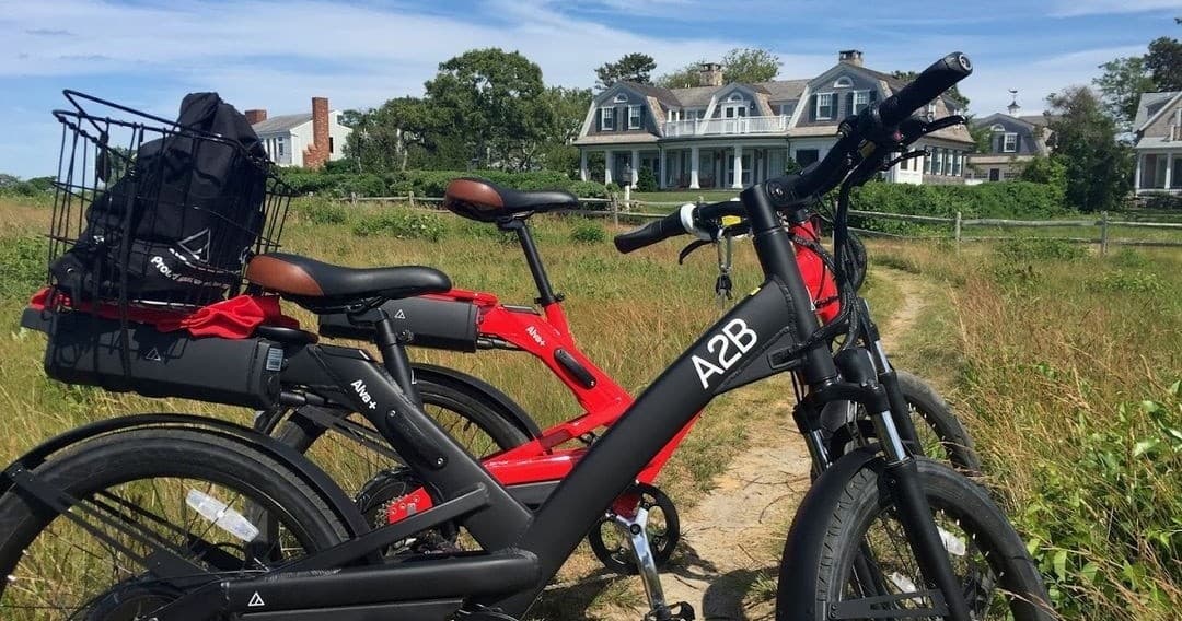Electric bikes parked in grassy coastal trail on Martha's Vineyard