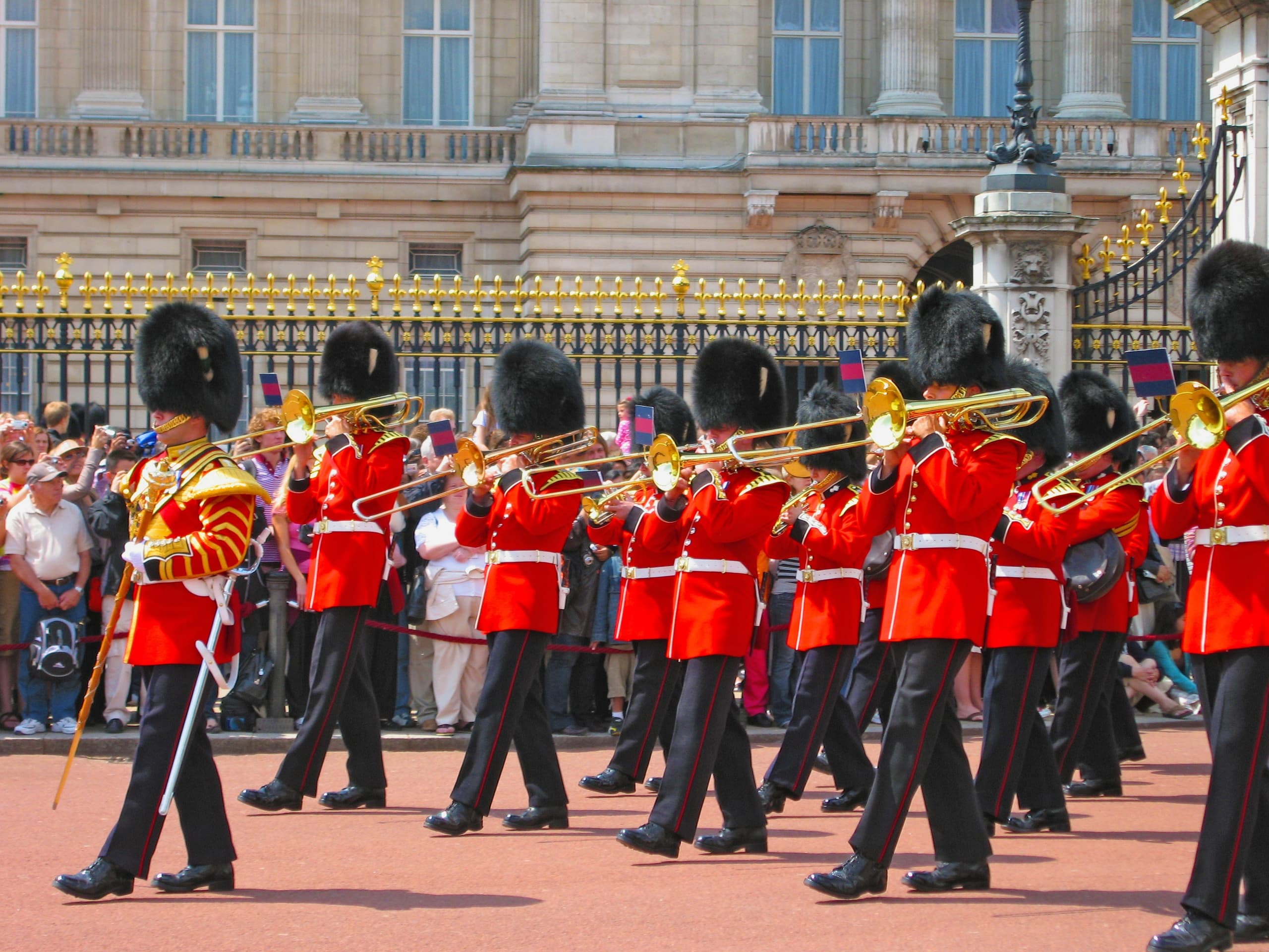 Guards marching outside Buckingham Palace during ceremonial parade