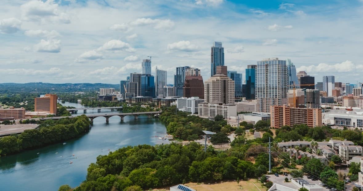 Austin river skyline with kayaks on calm water, urban paddling
