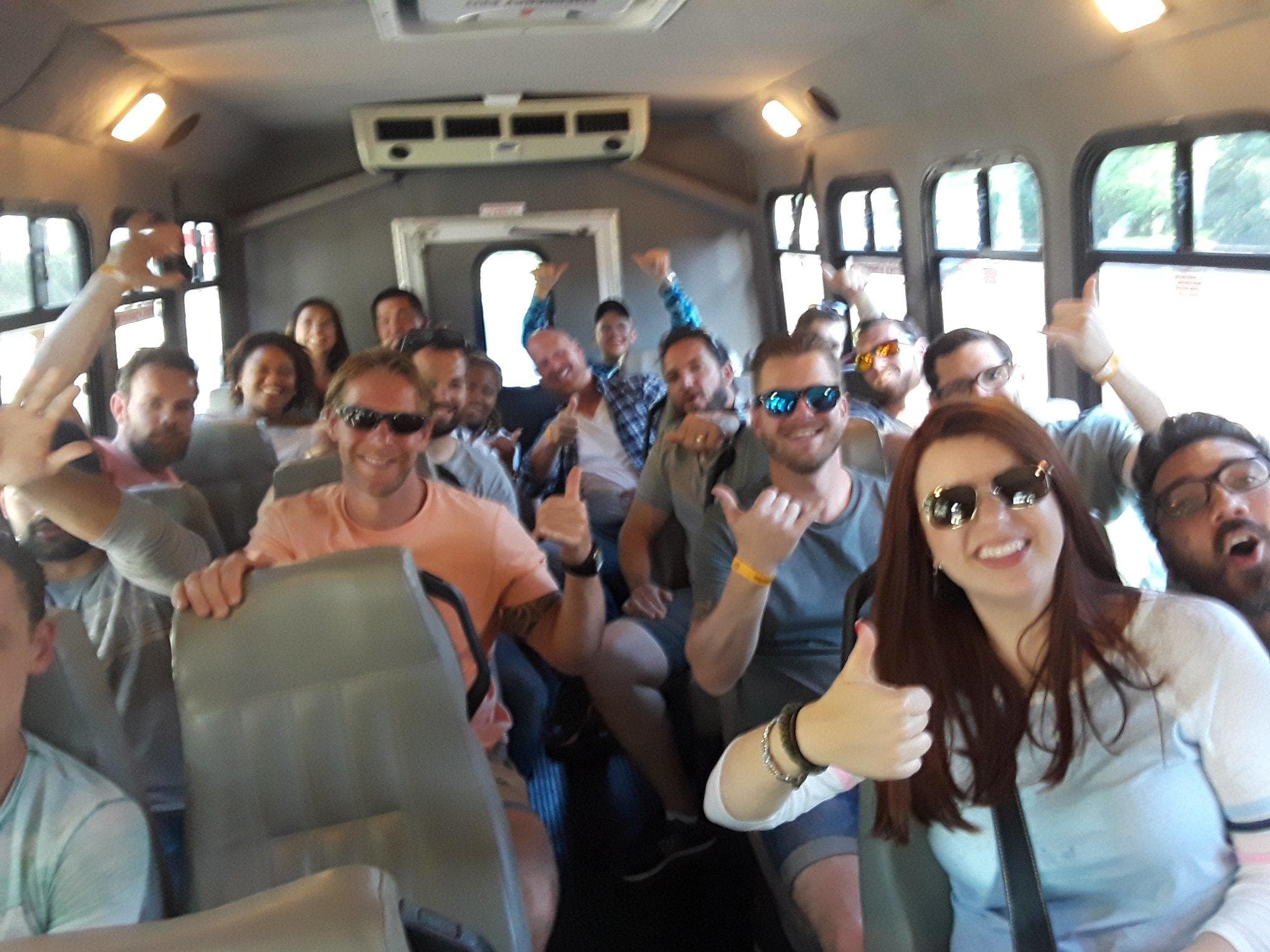 Passengers smiling inside shuttle van on Memphis tour