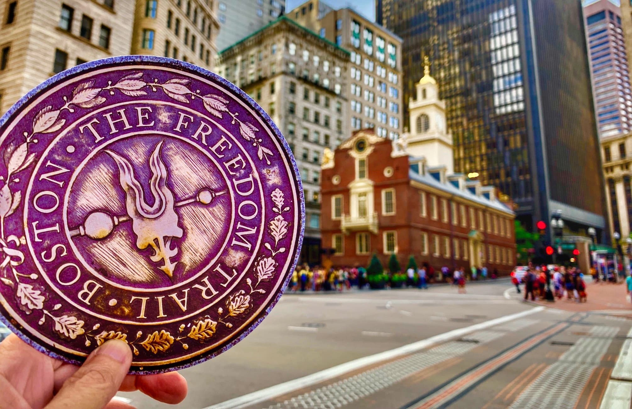 Freedom Trail medallion with historic Boston street view