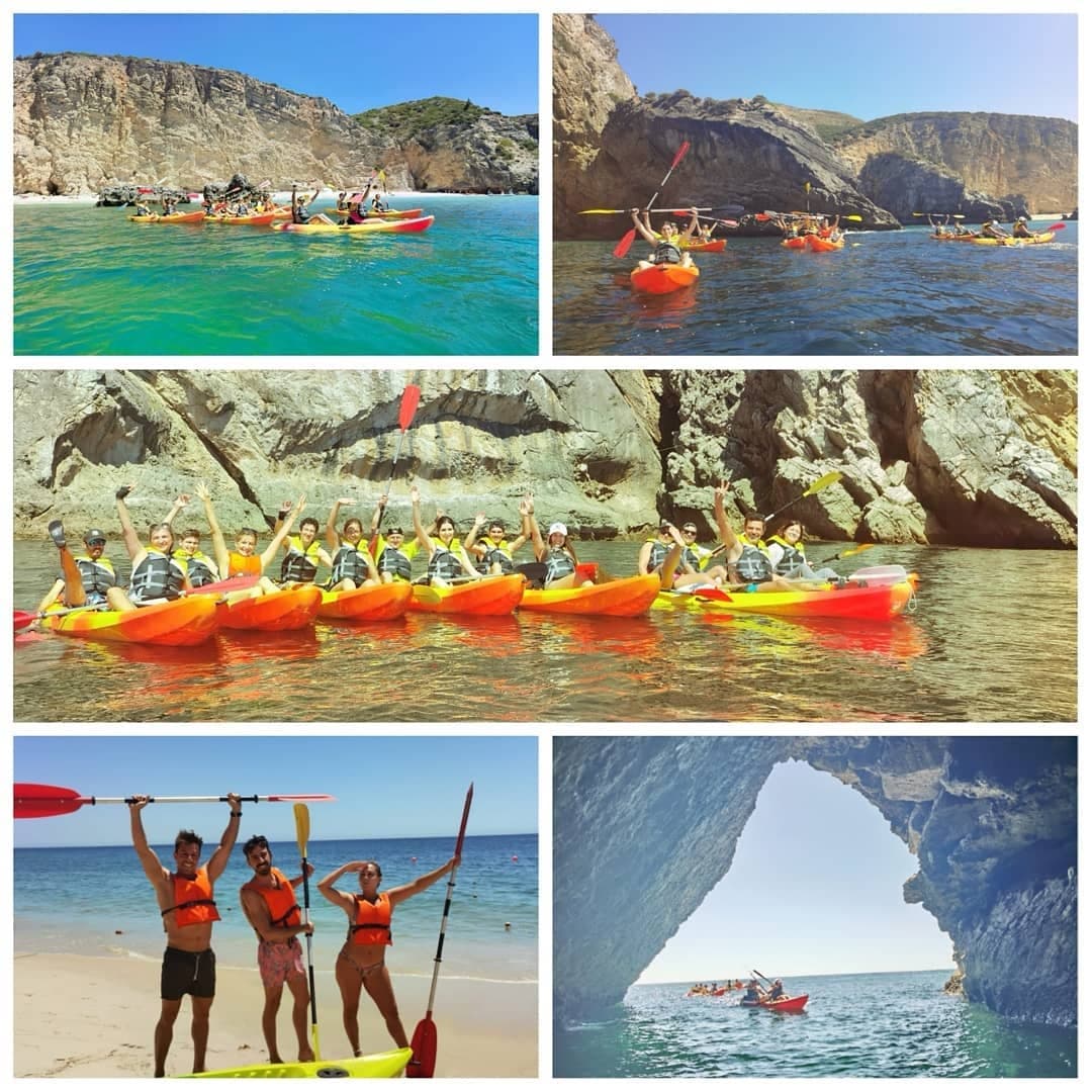 Sea kayakers paddling in clear water near dramatic coastal cliffs