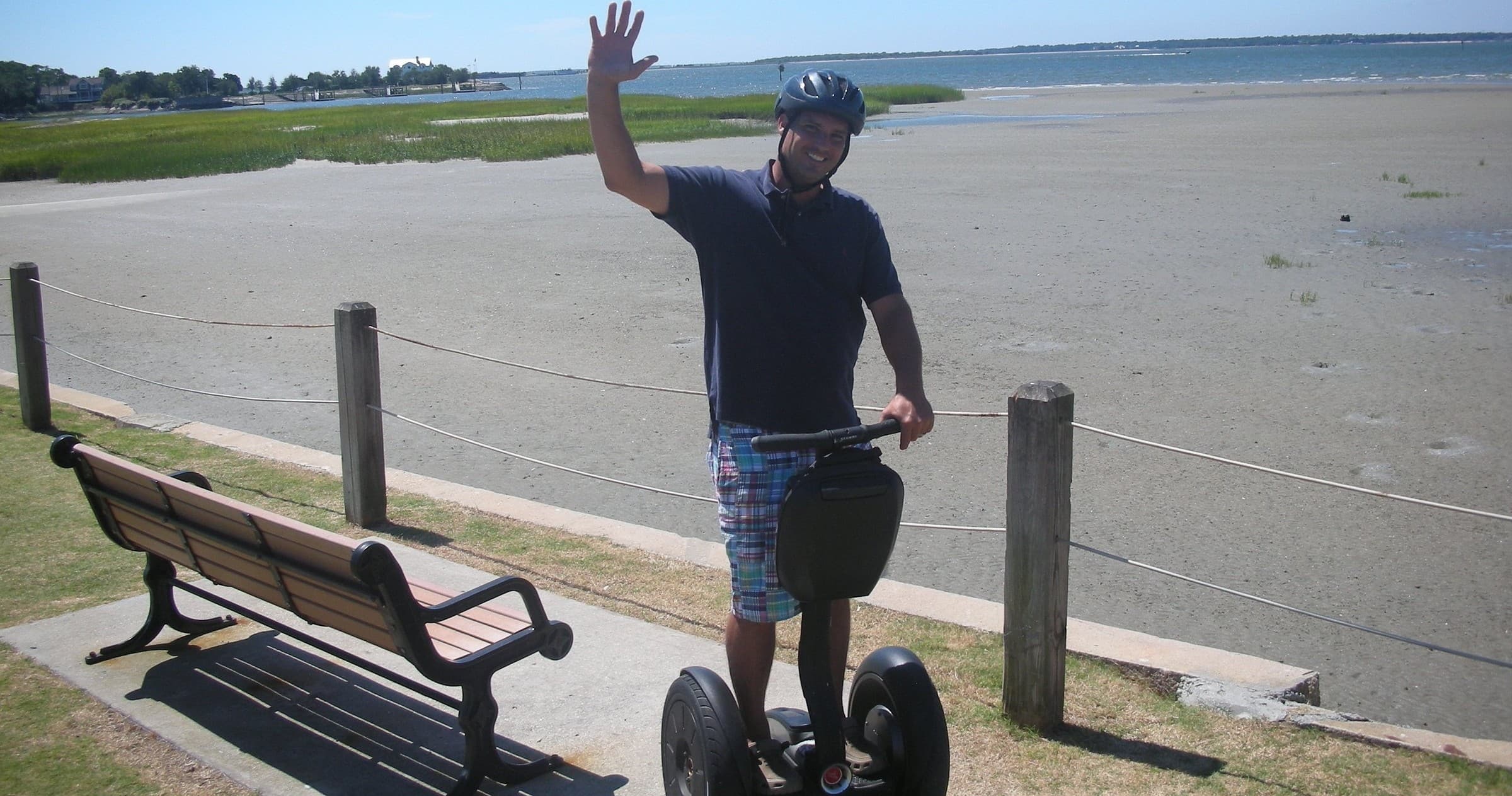 Segway tour along Charleston beachfront with rider waving