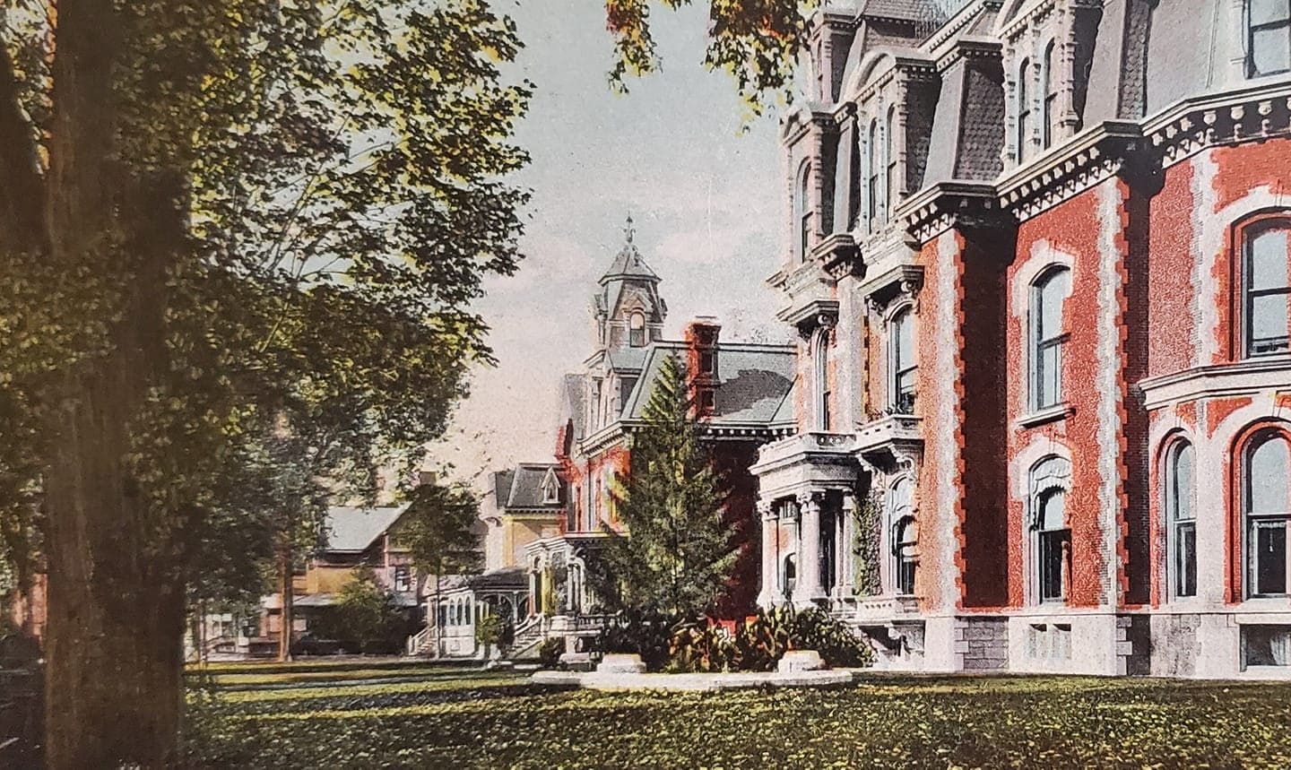 Vintage postcard view of Phelps Mansion and tree-lined grounds