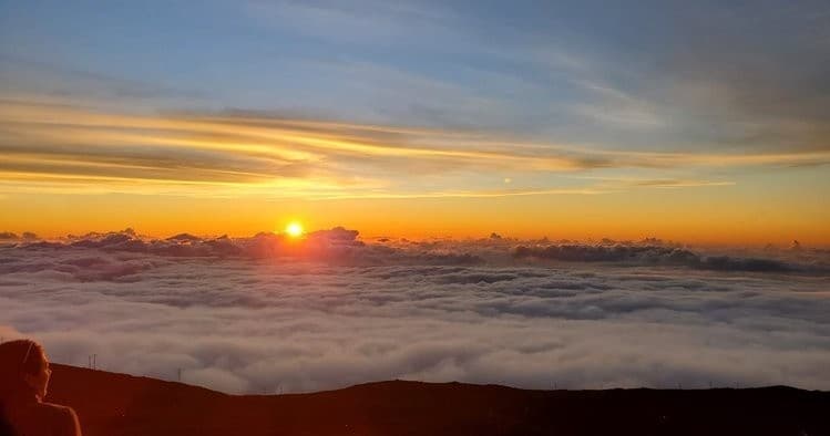 Sunrise over cloud inversion from Maui summit, panoramic view