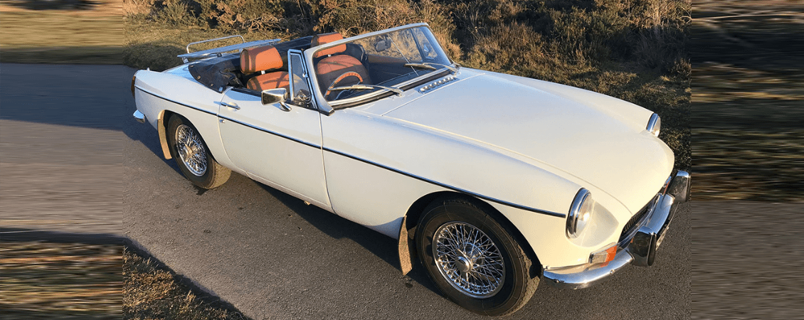 White classic convertible angled on country road for Jersey drive