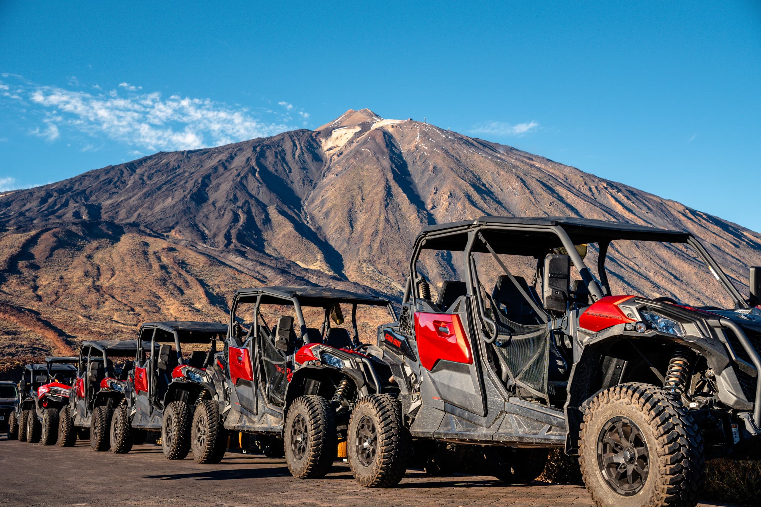 Line of off-road buggies at volcanic mountain in Tenerife