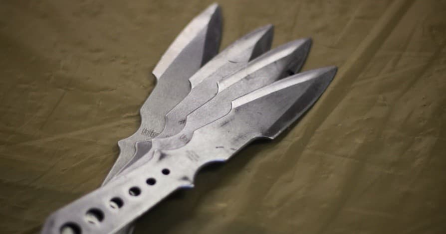 Set of metal throwing stars displayed for knife-throwing practice