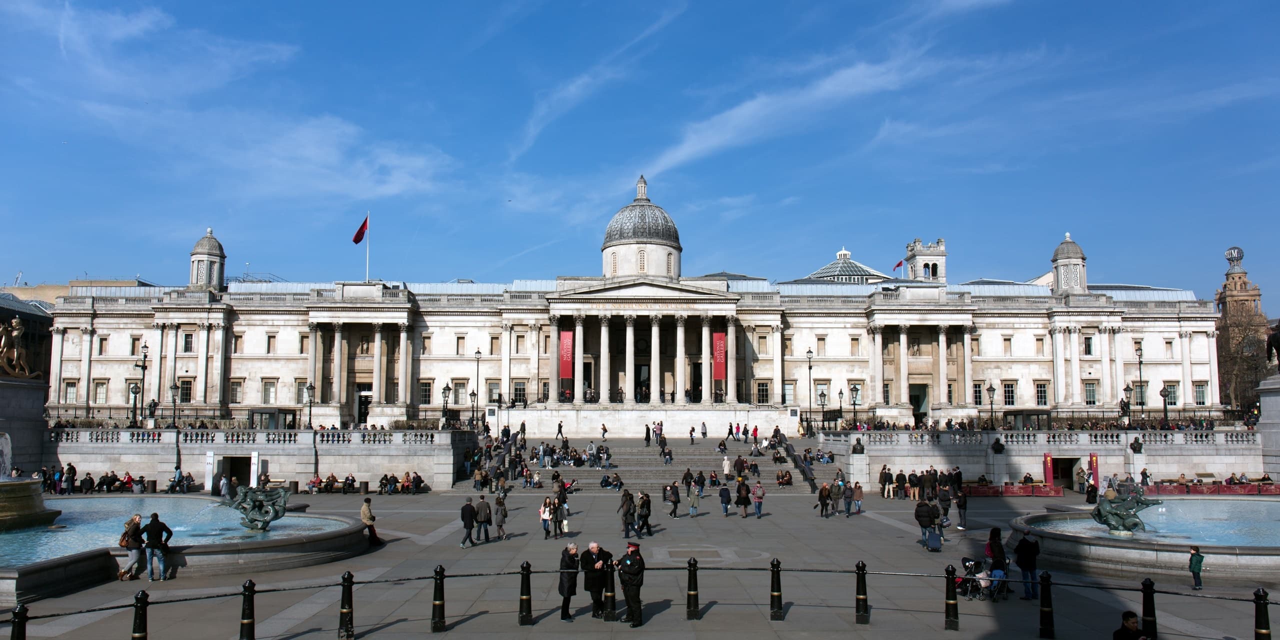 Trafalgar Square wide plaza with National Gallery in London