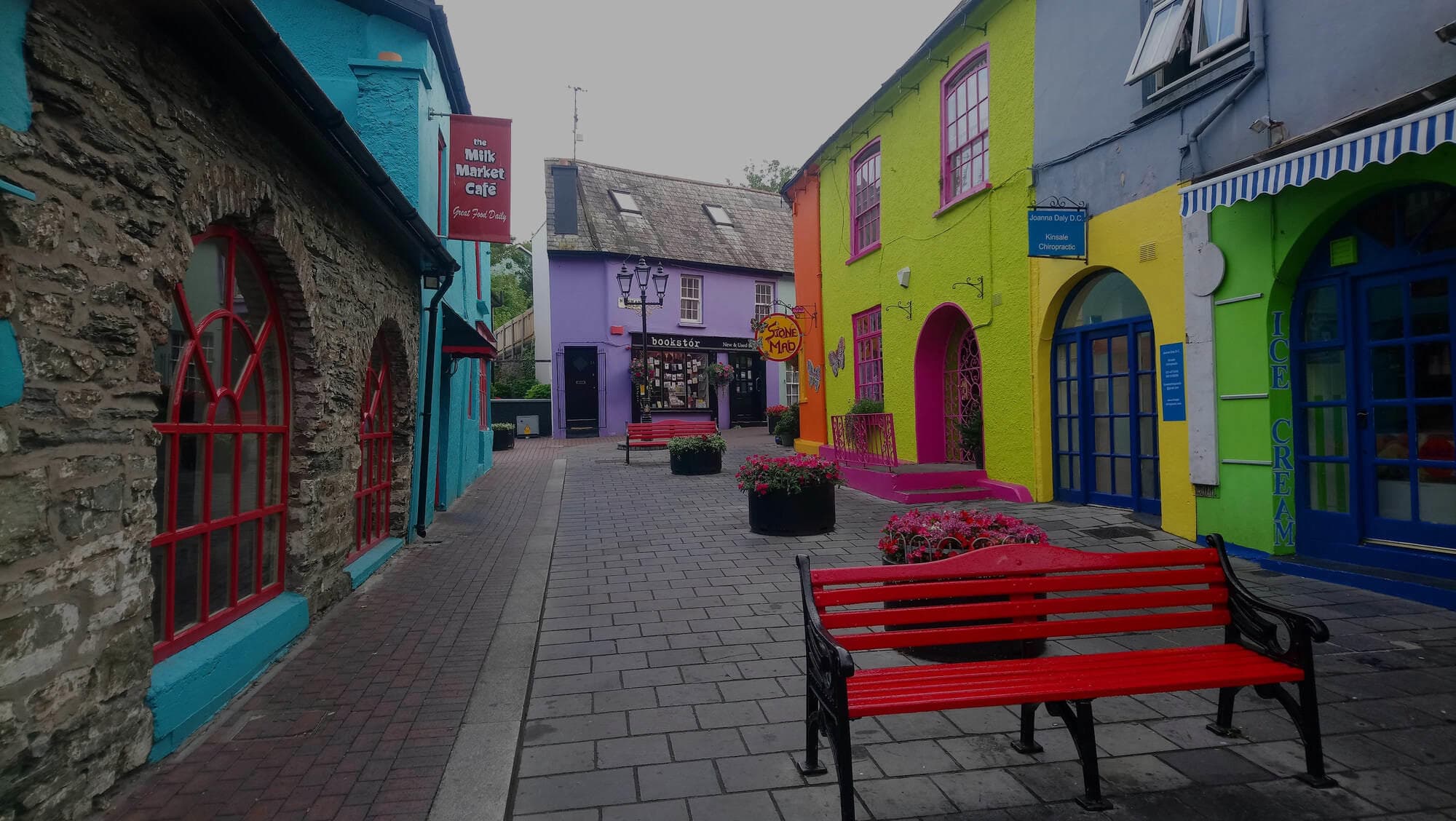 Colorful seaside village pedestrian street and benches