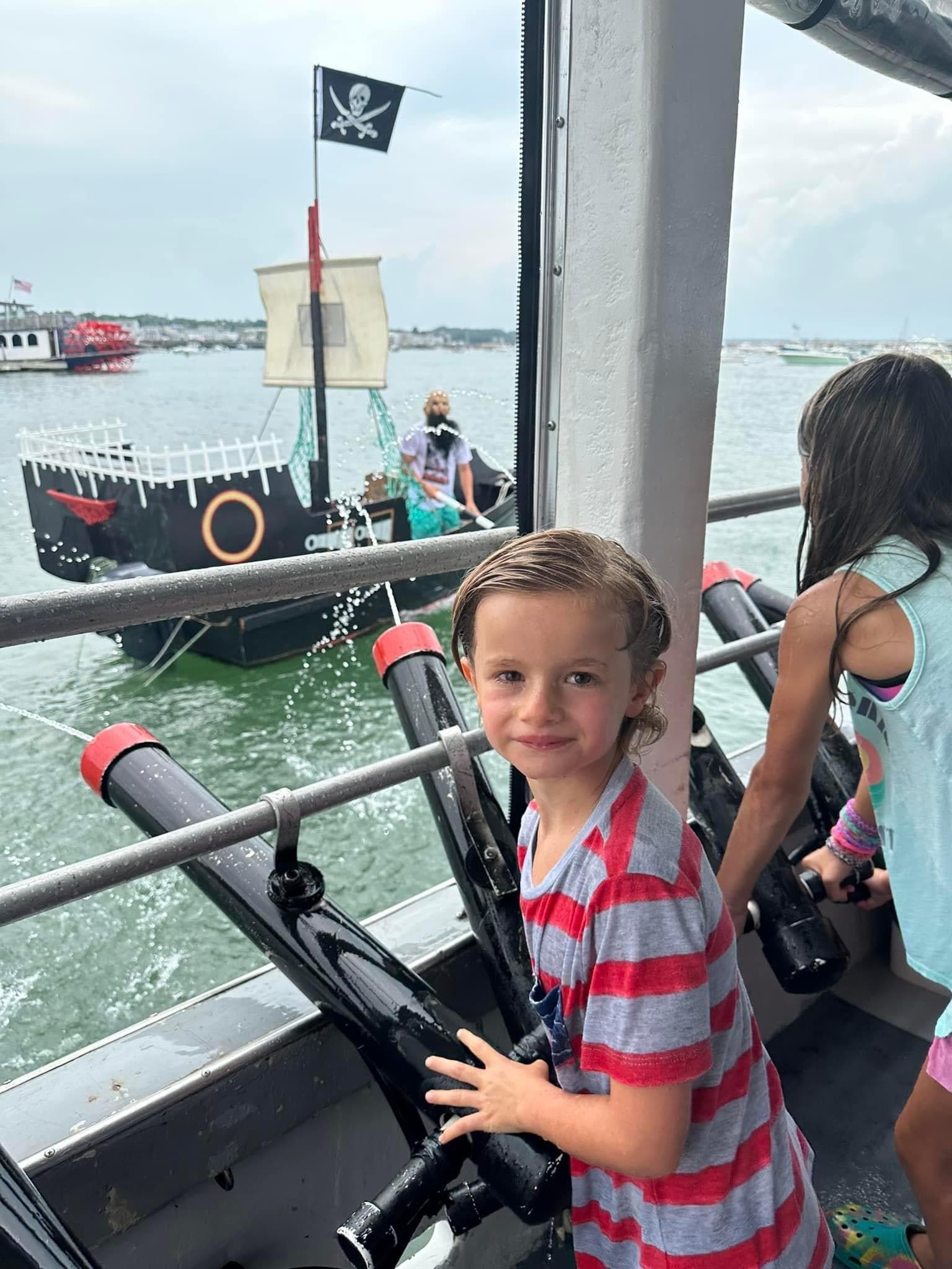 Child on deck of pirate sightseeing cruise in Plymouth harbor