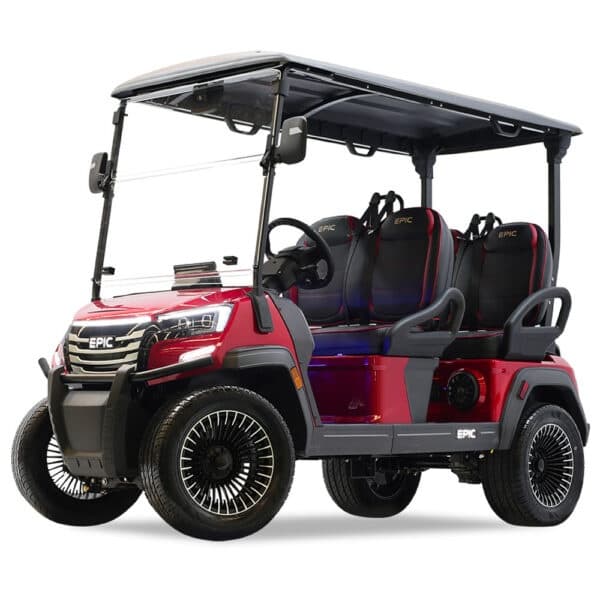 Red four-seat electric golf cart on white studio backdrop