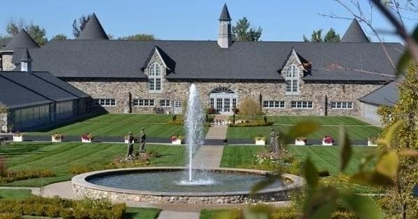 Stone manor and ornate fountain on Castle Farms grounds