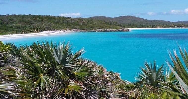 Aerial coastal panorama of turquoise water and shoreline
