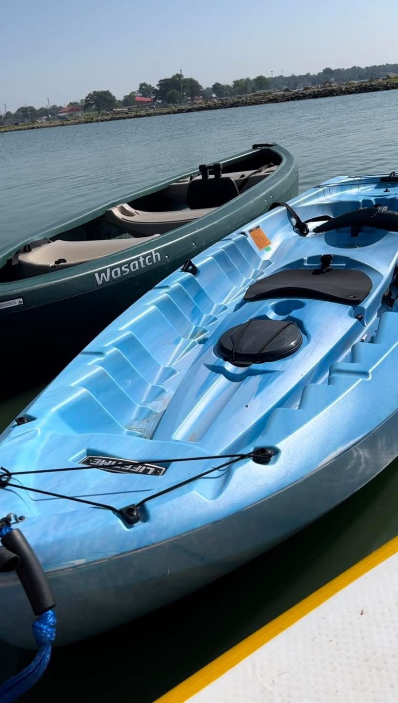 Two sea kayaks docked at marina ready for coastal paddling