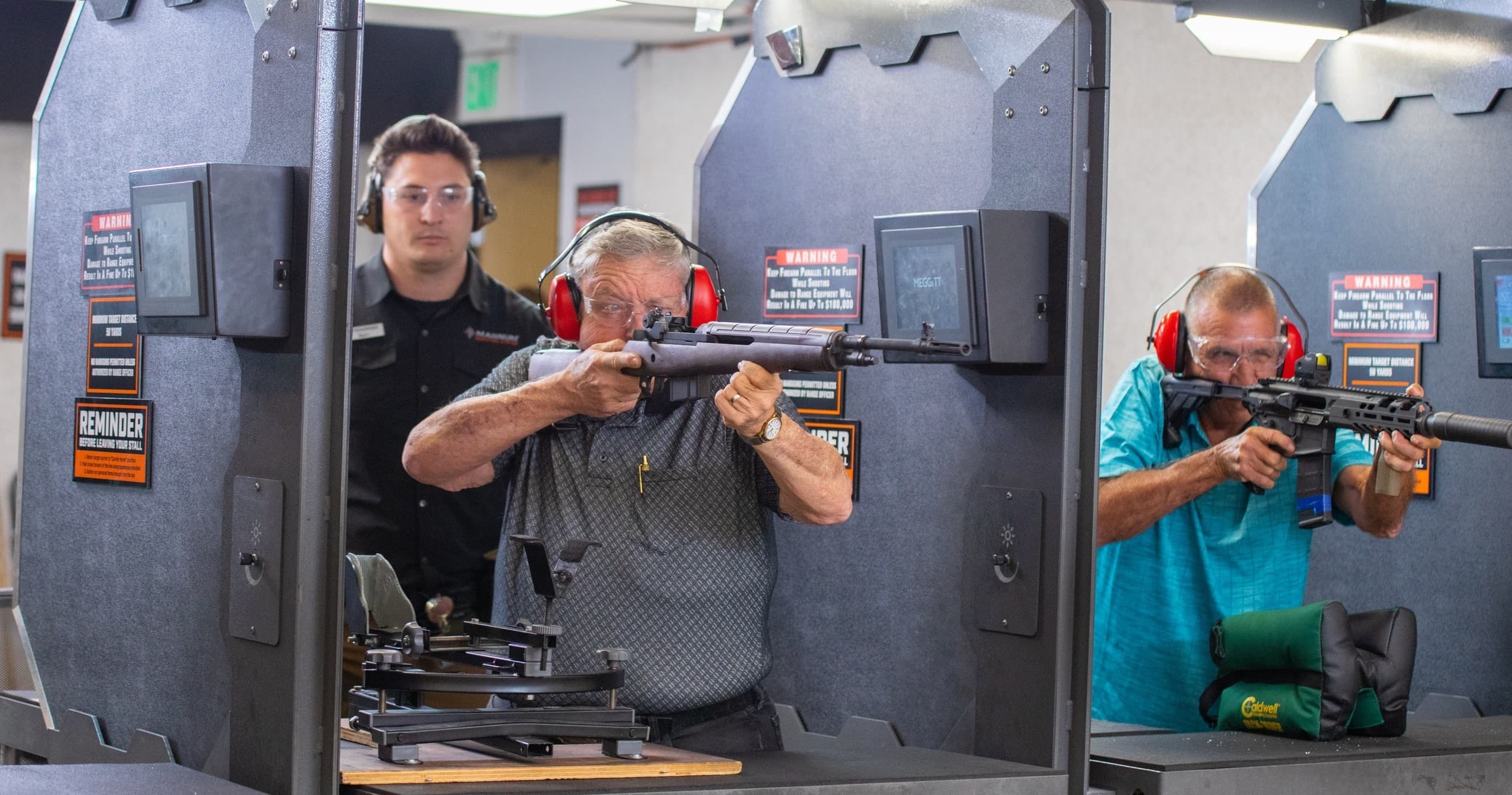 Two instructors demonstrating defensive firearm technique in class