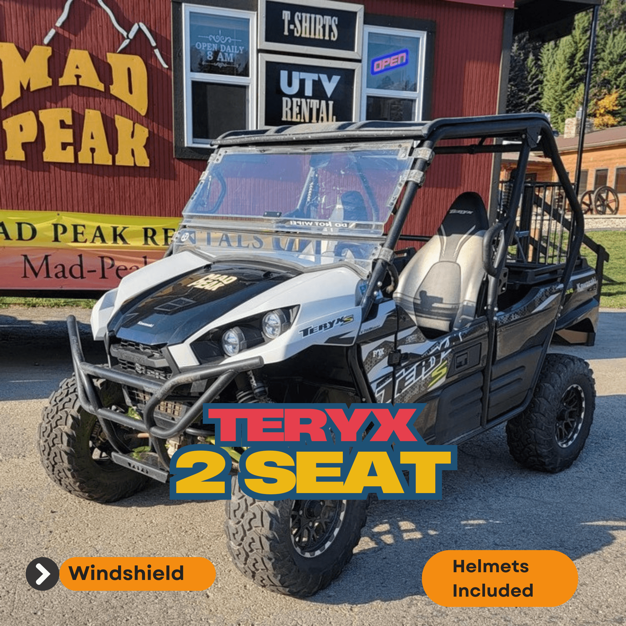 UTV two-seat rental parked in front of Mad Peak storefront