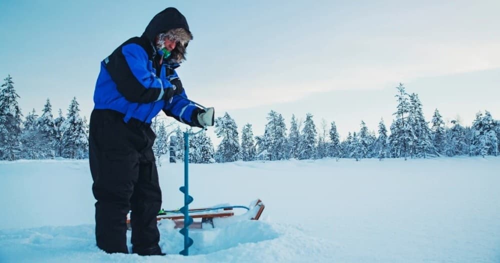 Ice Fishing Adventure at Kakslauttanen River