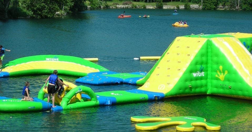 Close up of green inflatable climbing wall at Sheboygan quarry