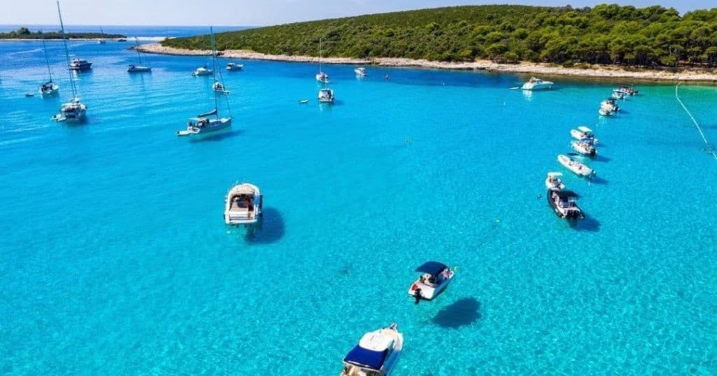 Aerial view of heart-shaped turquoise cove on Adriatic coast