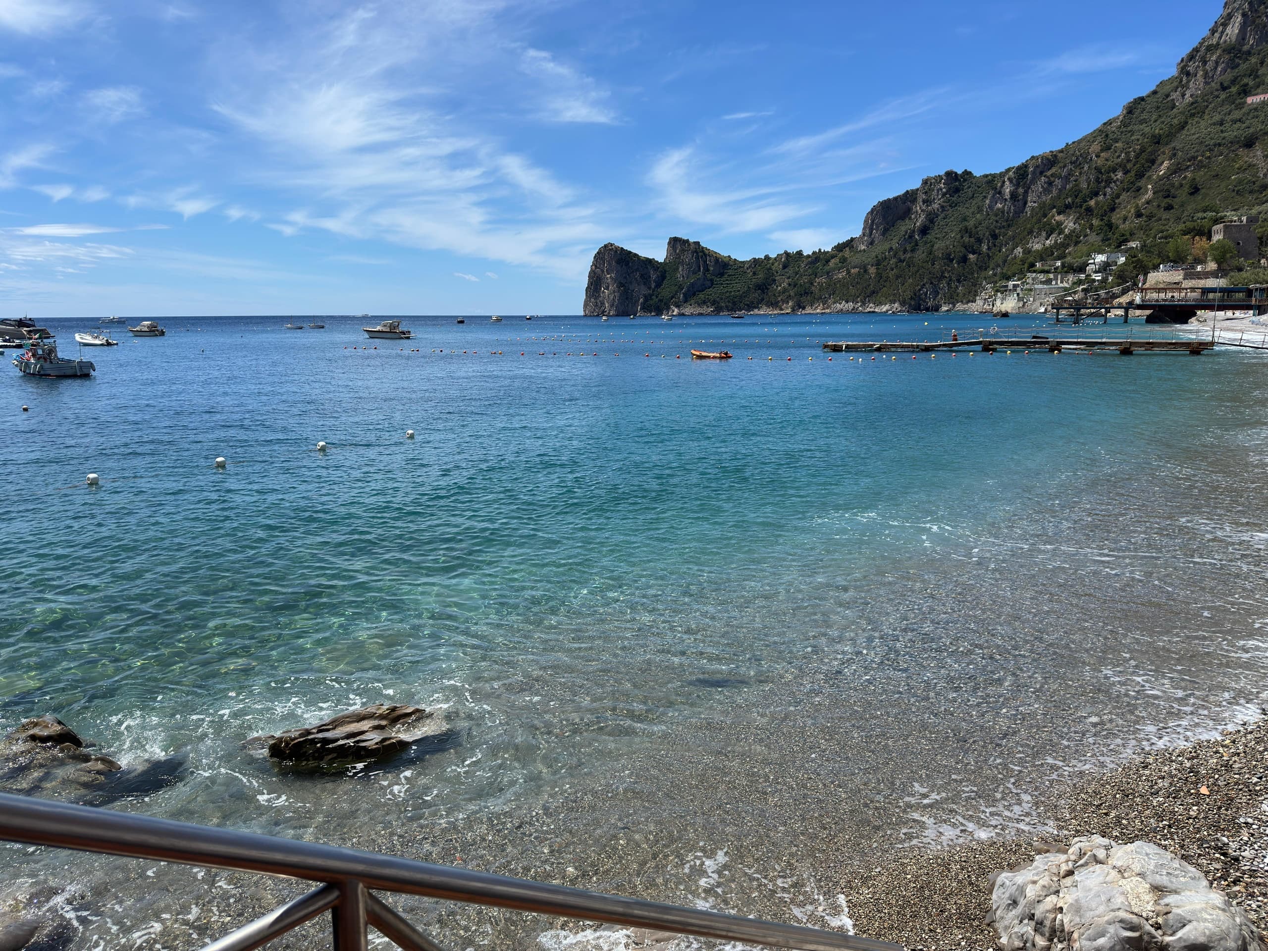Dramatic Faraglioni rock pillars framed from a touring boat